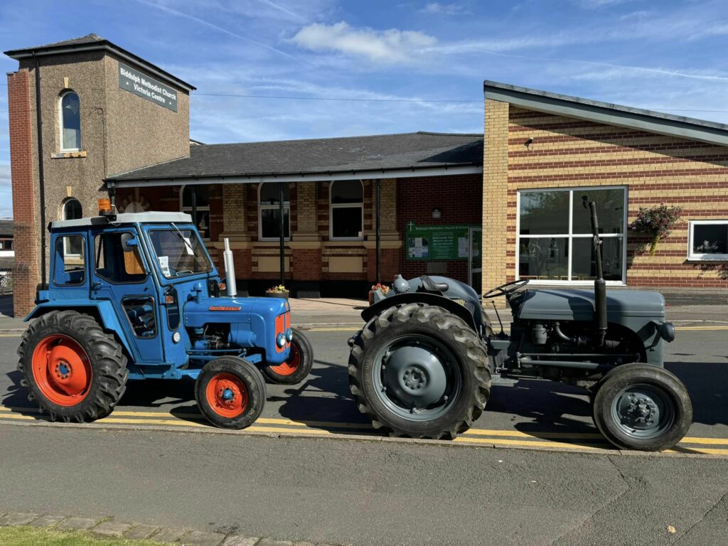 A photo of 2 tractors at the Classic Vehicle Show 2024 outside Biddulph Methodist Church on Station Road