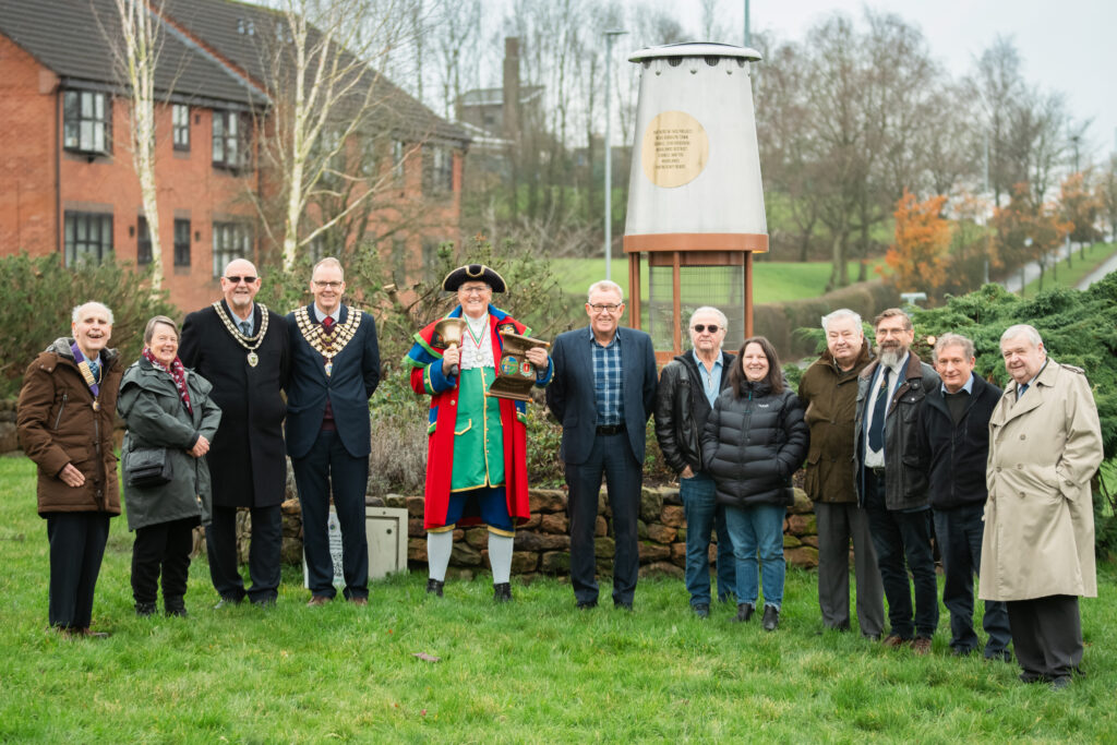 A group photo welcoming our partners to view the mining lamps on St John's roundabout