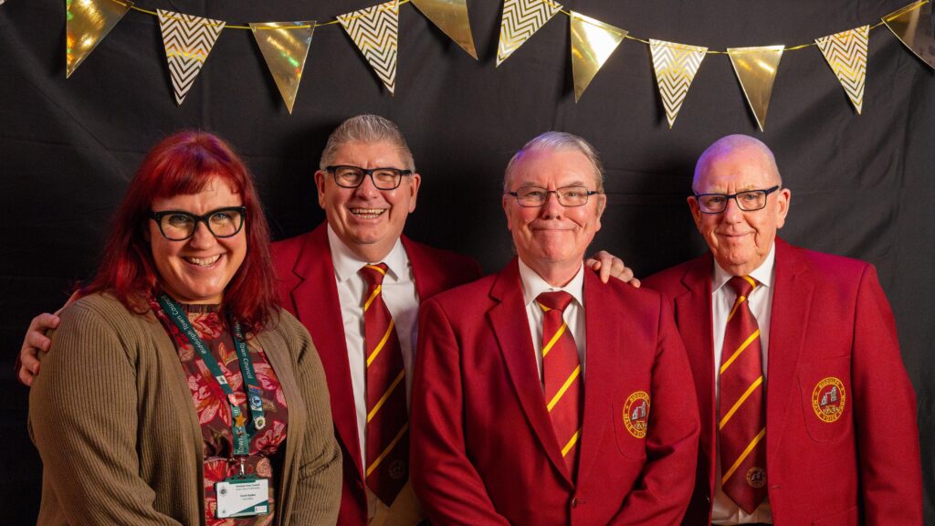 Mrs Sarah Haydon presenting the Community Wellbeing Award to members of Biddulph Male Voice Choir