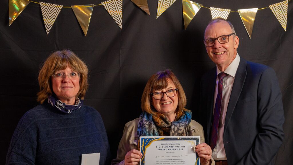 Councillor Yates presenting the Environment award to representatives from Biddulph Moor CORE group