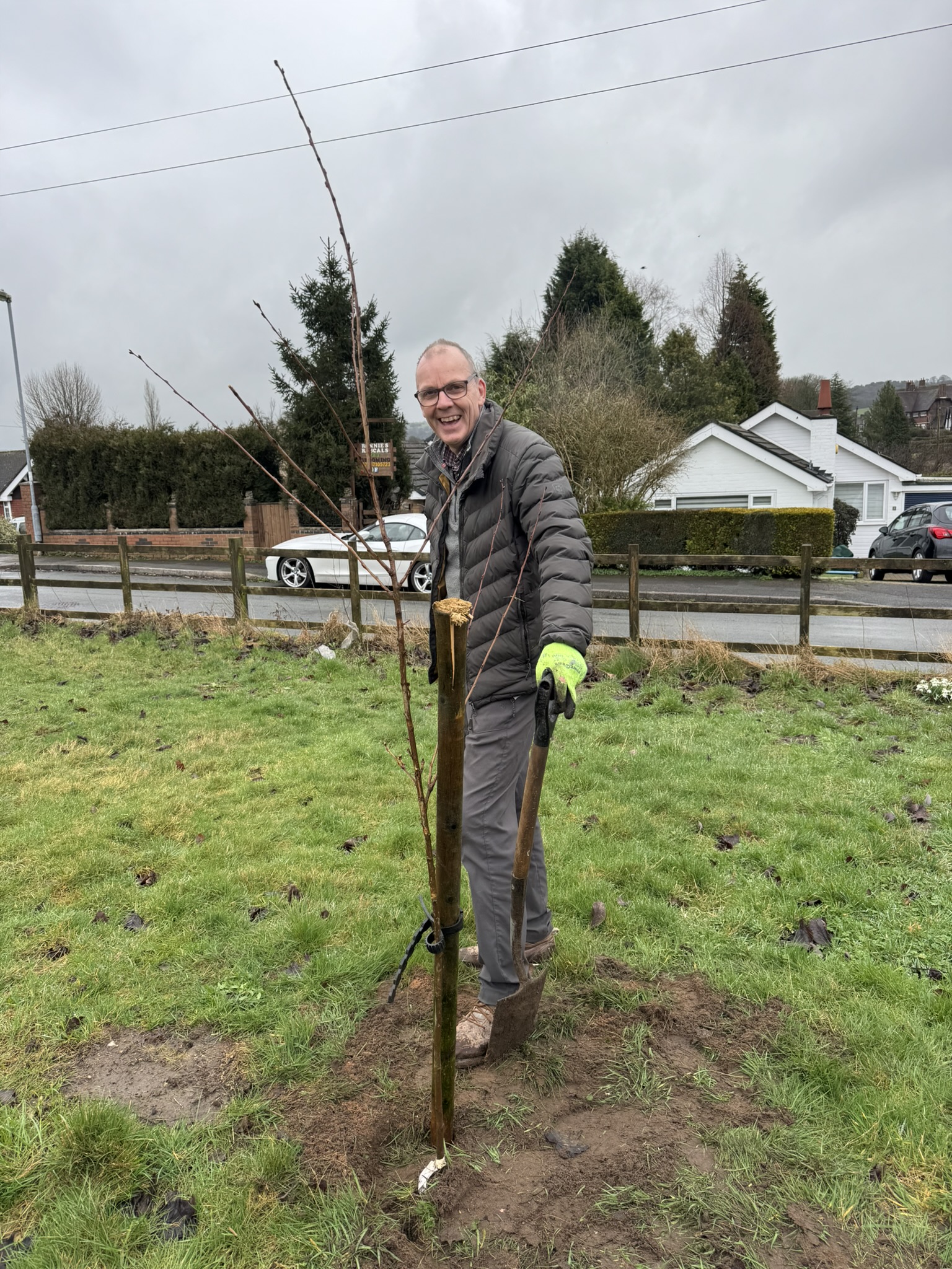 Councillor Nigel Yates planting one of the trees