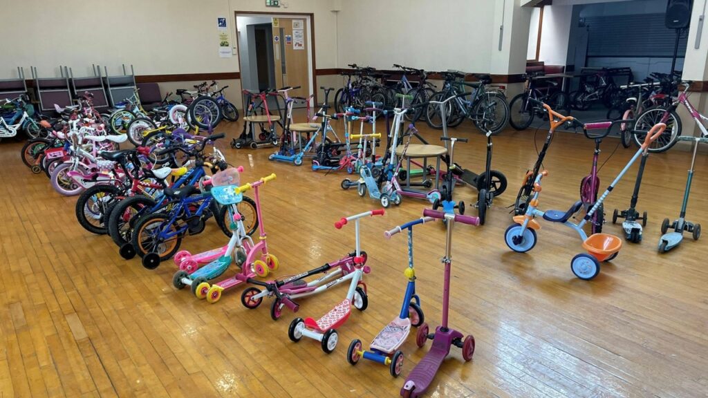 Bikes, trikes and scooters in the Town Hall ready for the bike sale