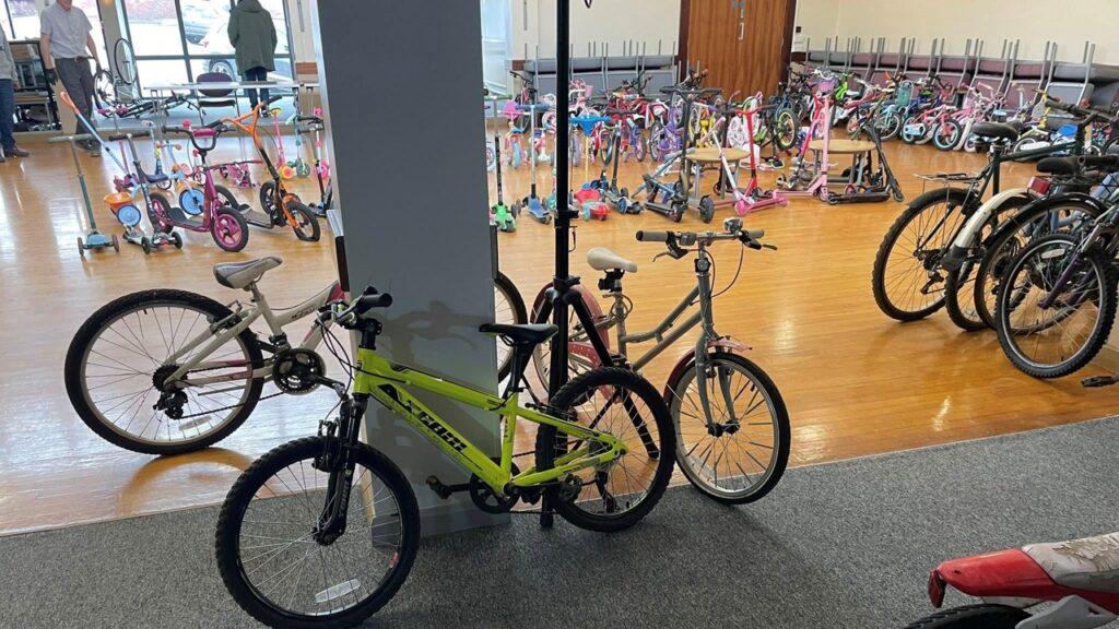 Bikes, trikes and scooters in the Town Hall ready for the bike sale