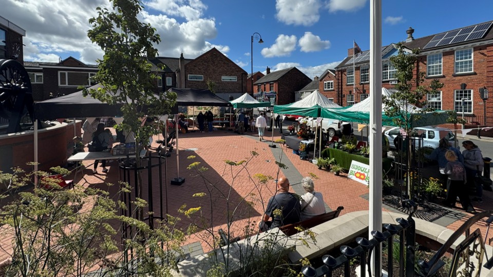 A view of the Town Hall frontage showing the stalls/market